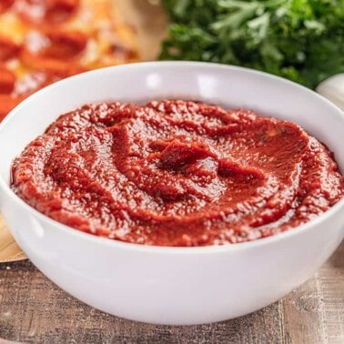 Homemade pizza sauce in a white bowl.