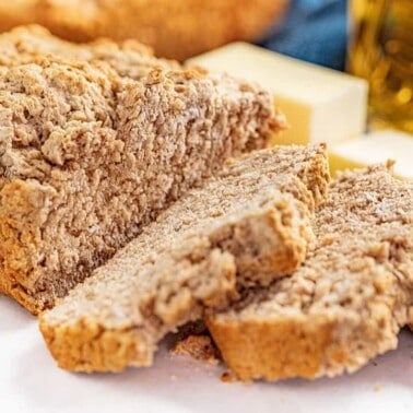 A loaf of beer bread cut into a few slices.