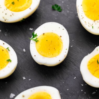 Close up overhead view of hard boiled egg halves.