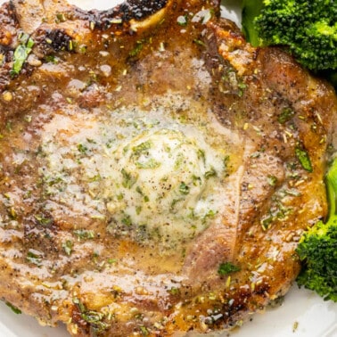 Overhead view of a pork chop cooked in an air fryer.