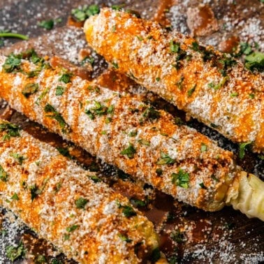 Three pieces of Mexican street corn.