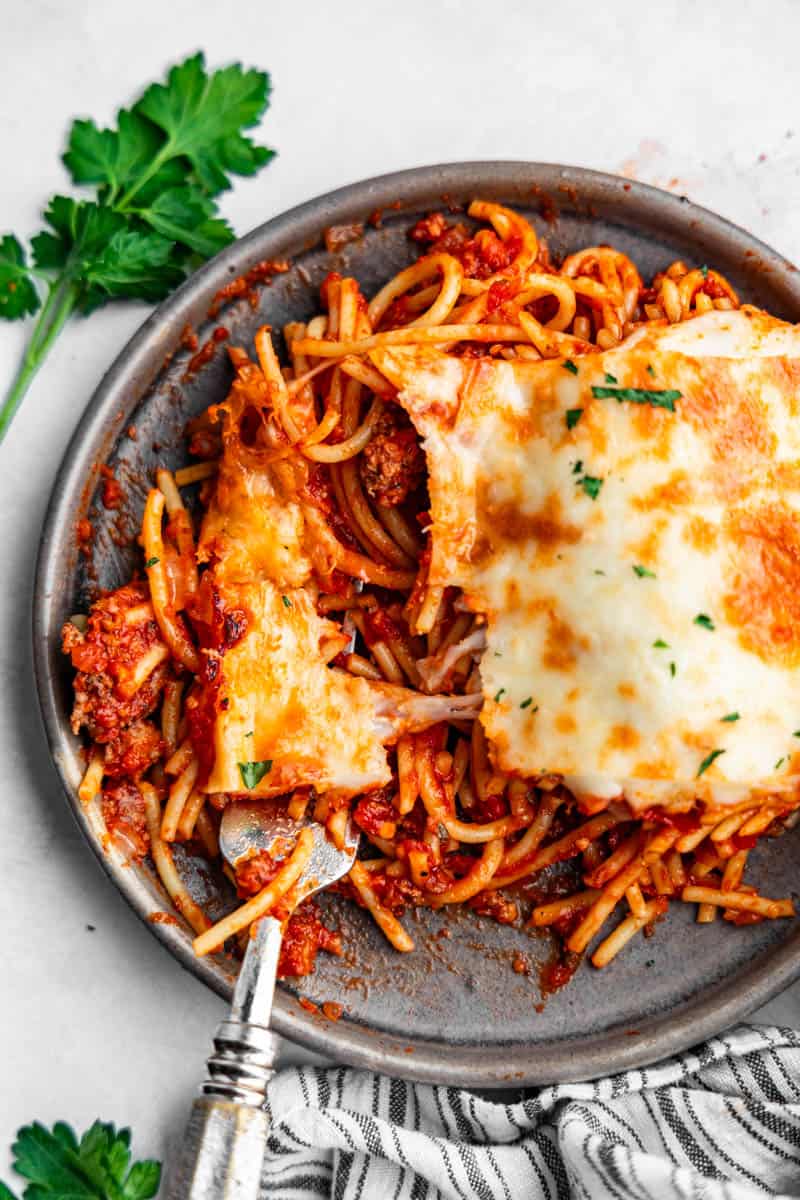 An overhead birds-eye view of baked spaghetti on a plate.