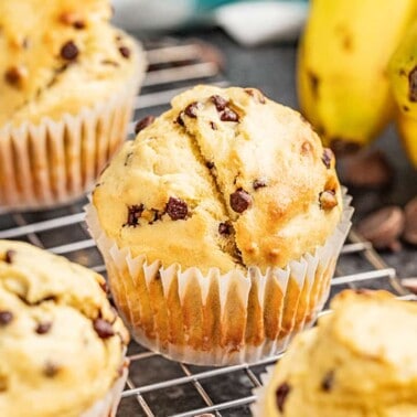 Banana chocolate chip muffins on a cooling rack.