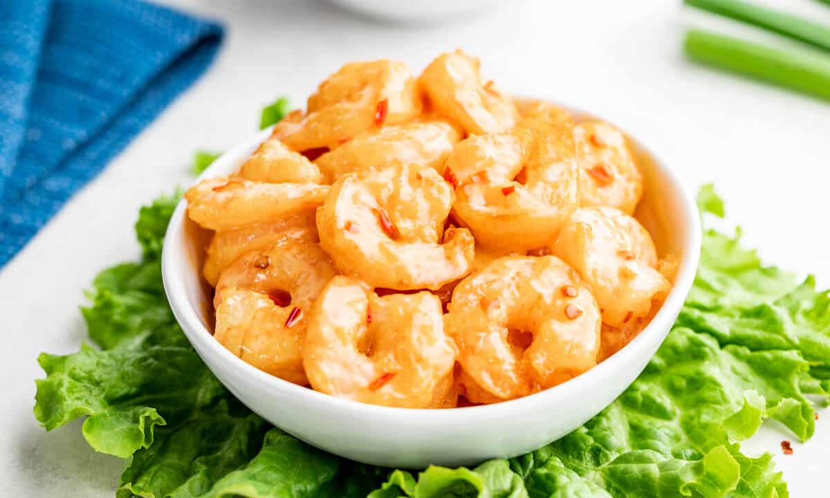 Bang bang shrimp in a white serving bowl.