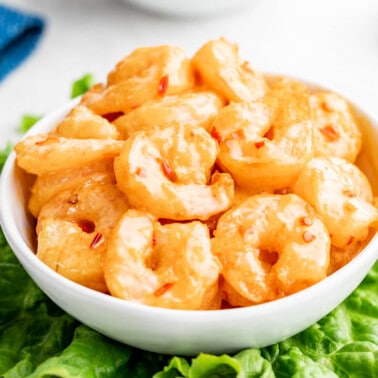 Bang bang shrimp in a white serving bowl.