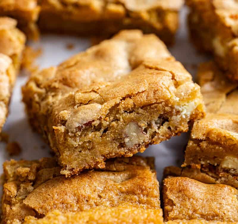 A close up view of squares of browned butter blondies.