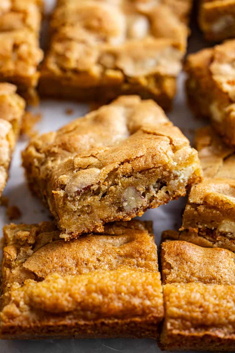 A close up view of squares of browned butter blondies.