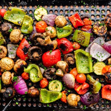 An overhead view of vegetables on a grill basket.