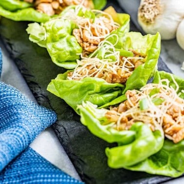 Chicken lettuce wraps in a row.