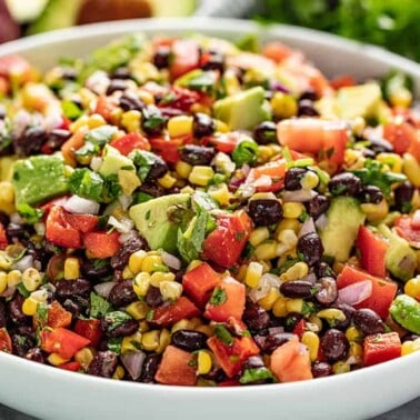 Simple black bean and corn salad in a white serving bowl