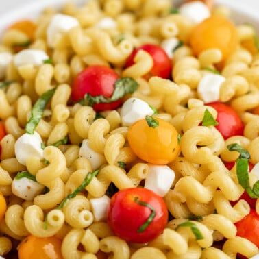 Close up view of caprese pasta salad.