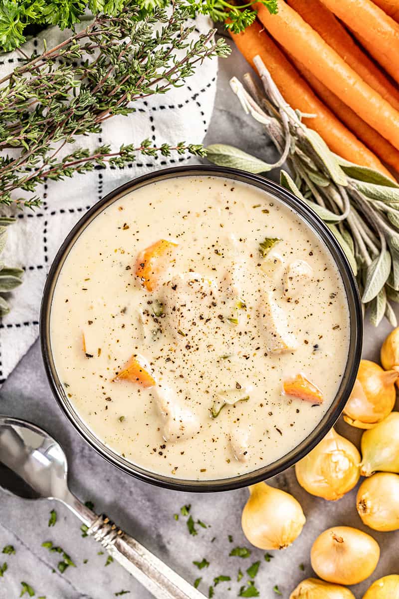 Overhead view of a bowl of chicken soup.