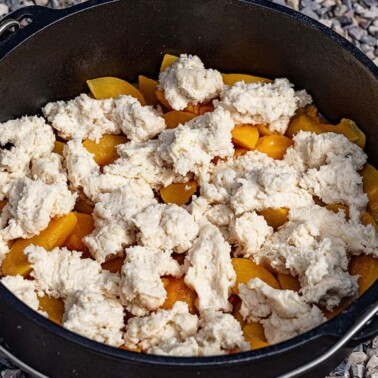 Peach cobbler in a dutch oven