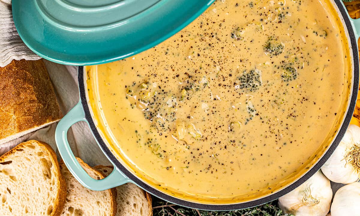 Overhead view of a large pot filed with broccoli cheddar soup.