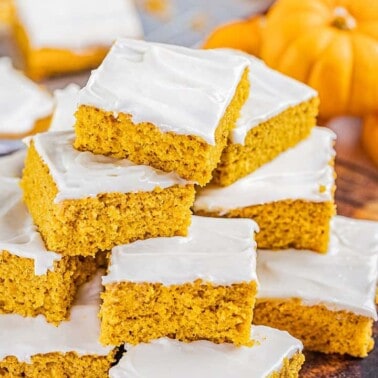 A large stack of pumpkin bars.