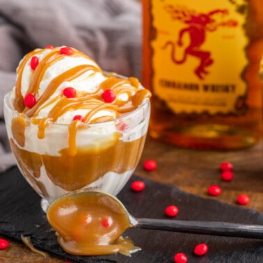 Fireball cinnamon caramel sauce in a glass jar and on an ice cream sundae.