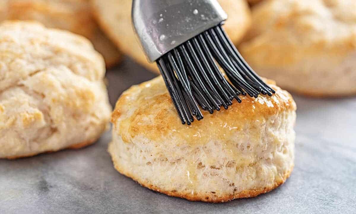 Butter brushed onto a freshly baked biscuit