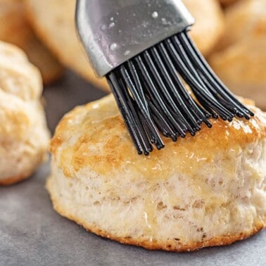 Butter brushed onto a freshly baked biscuit