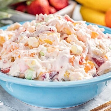 Ambrosia salad in a blue bowl.