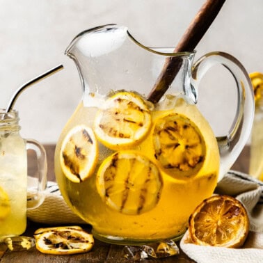 A pitcher and glasses of grilled lemonade.