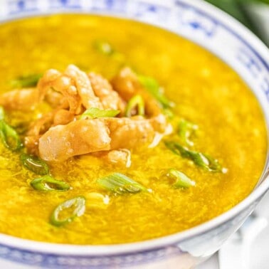 Close up view of a bowl filled with egg drop soup.