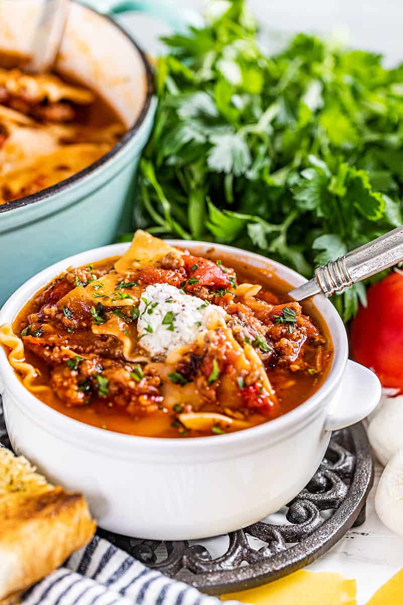 A white bowl of lasagna soup.