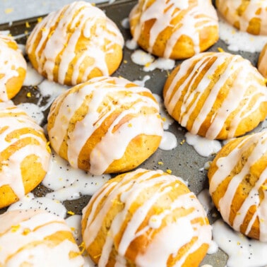 A muffin pan filled with lemon poppyseed muffins.