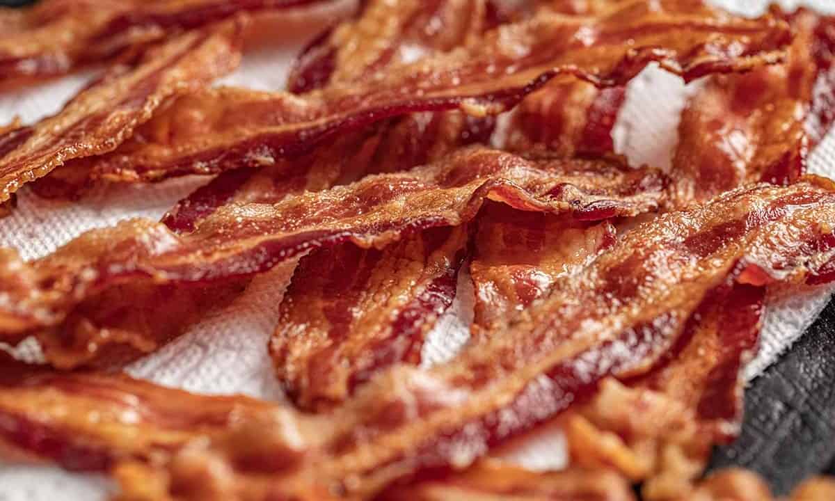 Oven cooked bacon on paper towel