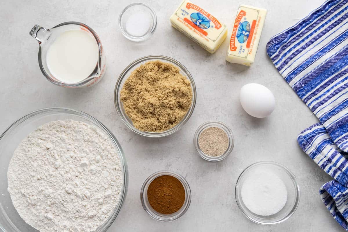 Raw ingredients measured out for cinnamon rolls.