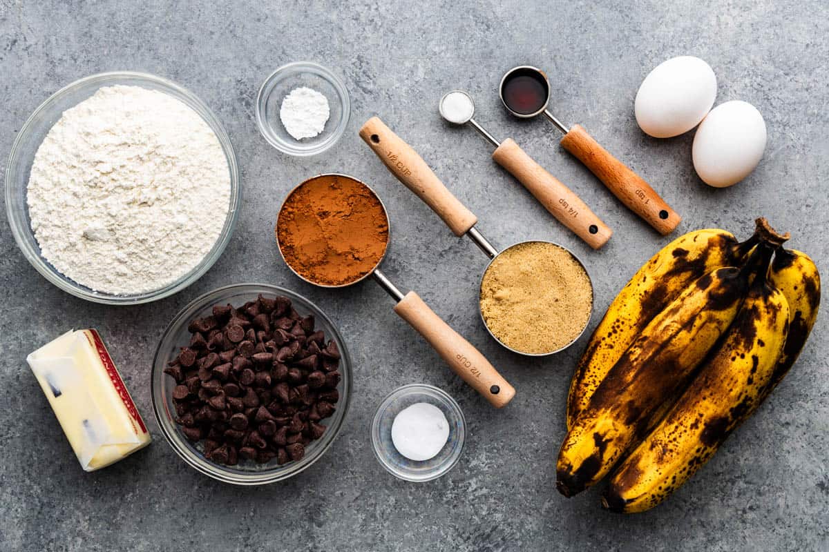 An overhead view of measured ingredients and ripe bananas needed for this recipe.