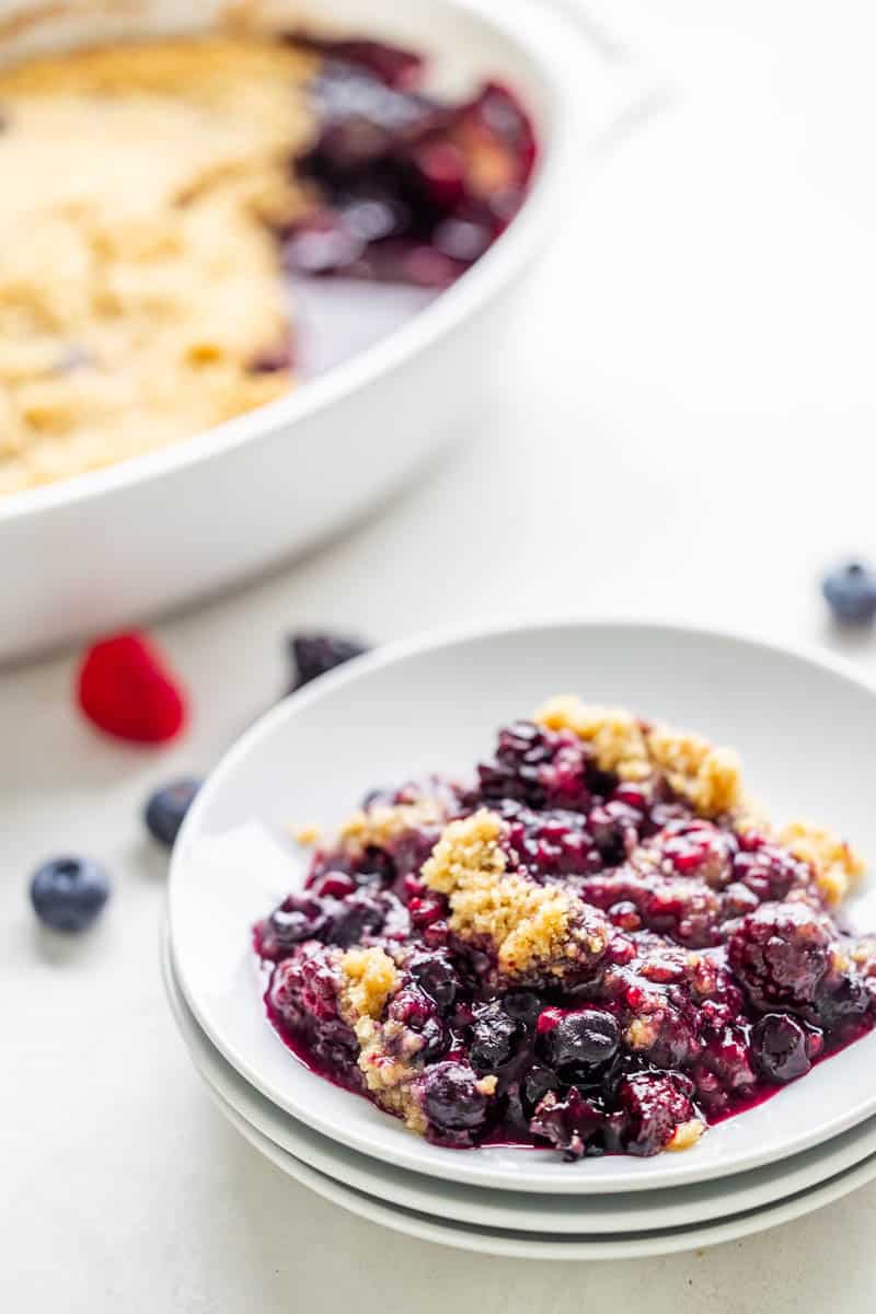 Mixed berry crumble served on a dessert plate.