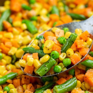 Mixed veggies in a spoon.