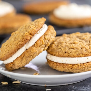 Oatmeal cream pies on a dessert plate.