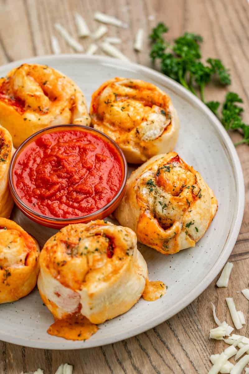 Pizza rolls and marina sauce on a serving platter.