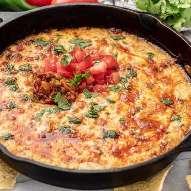 A skillet of queso fundido with chorizo