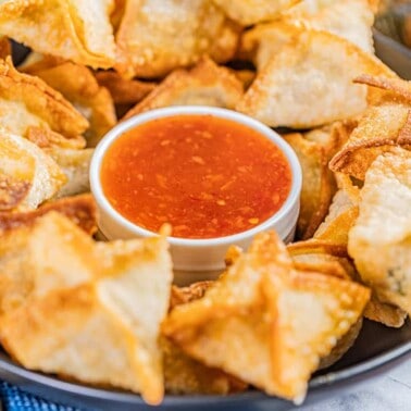 Savory sausage wontons with sweet and sour sauce.