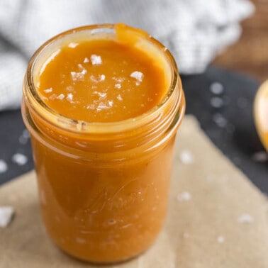 Sea salt caramel sauce in a glass jar.