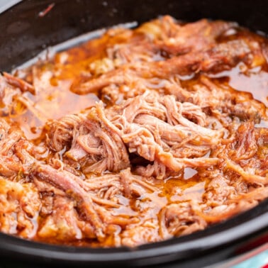 Sweet pulled pork in a slow cooker.