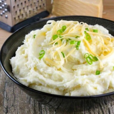 Smoked Gouda Mashed Potatoes in a black bowl.