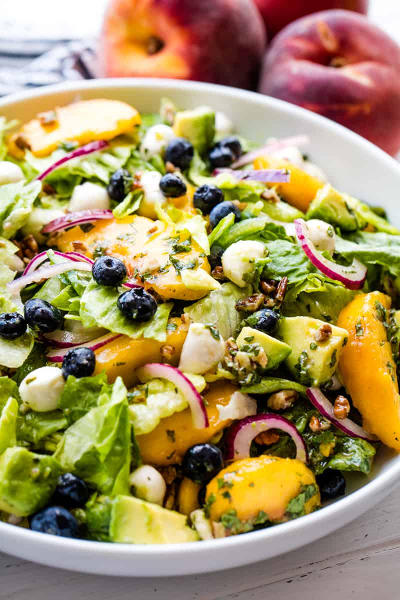 Peach Salad in a white bowl.