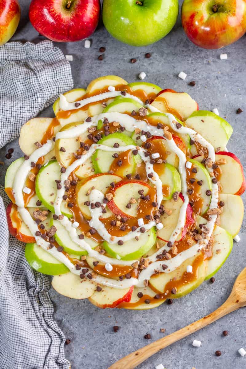 Apple nachos with caramel on a plate.