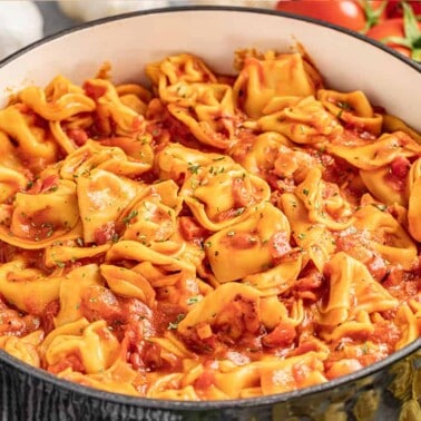 Tomato tortellini soup in a stock pot.