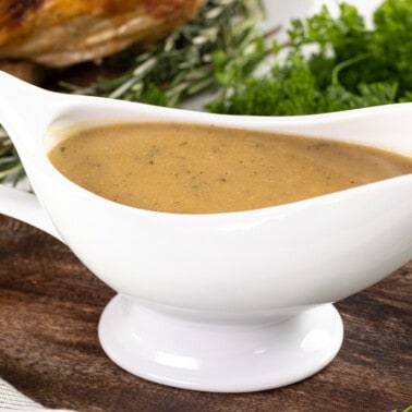 Turkey gravy in a white gravy boat.