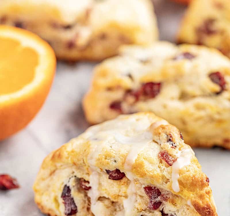 Cran-Orange Scones with a cut orange.