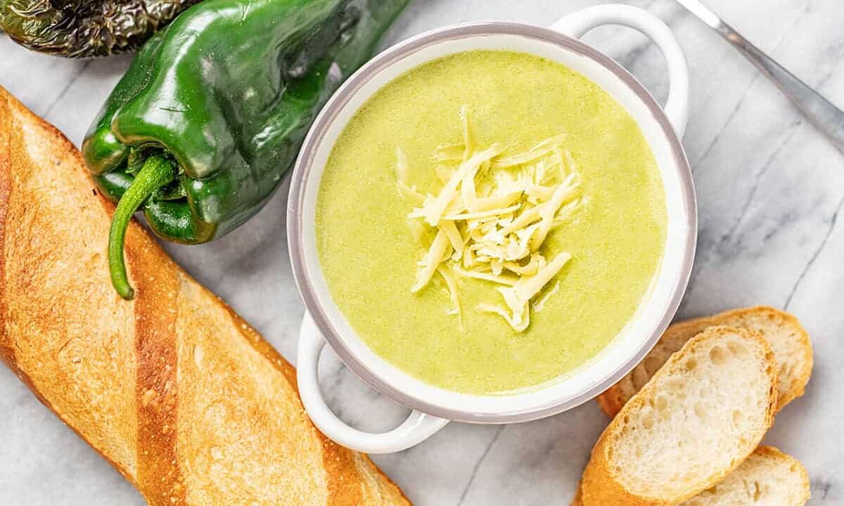 Bird's eye view of Roasted Poblano White Cheddar Soup in a white bowl.