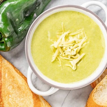 Bird's eye view of Roasted Poblano White Cheddar Soup in a white bowl.